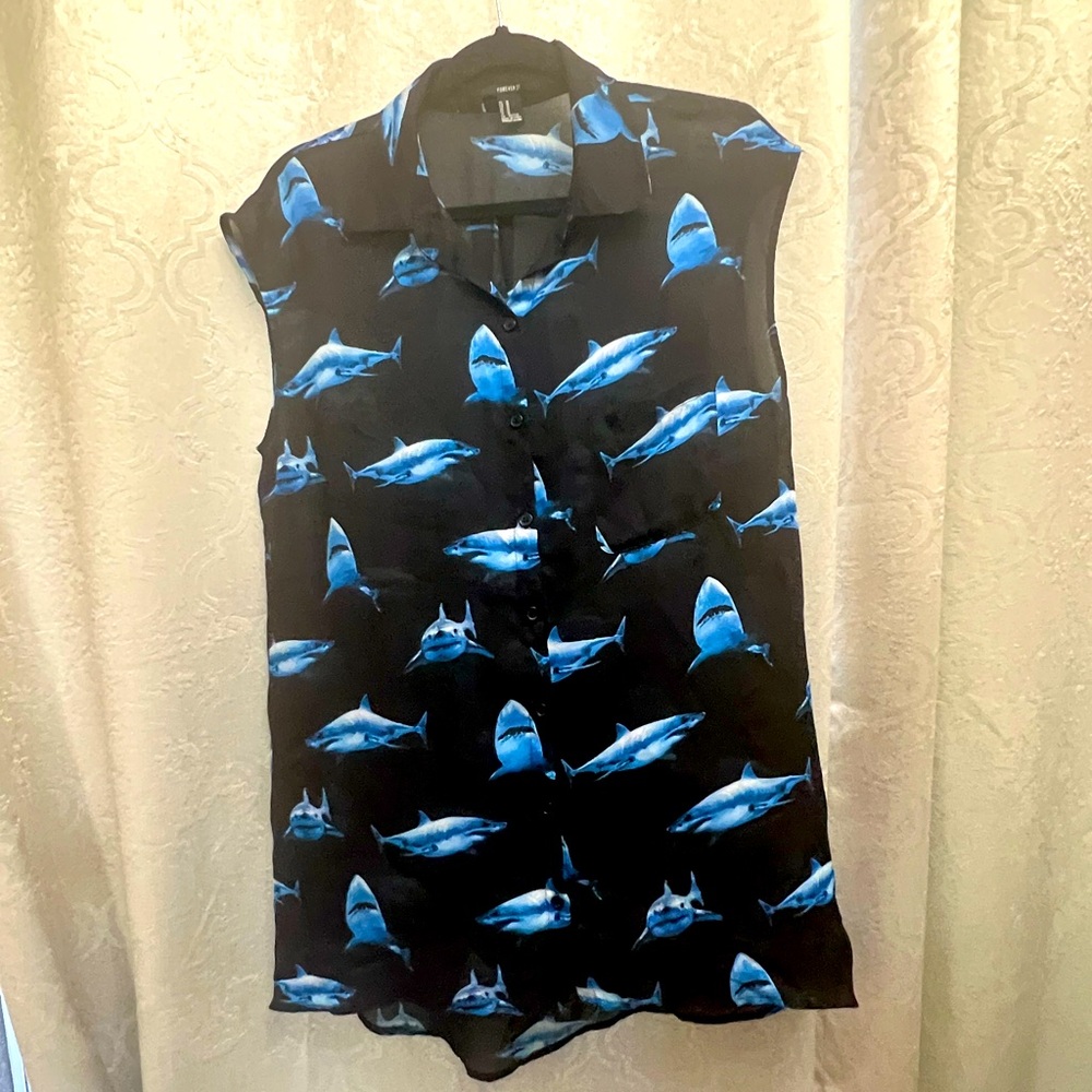 Sheer shark print high-low hem top. Button down front.
